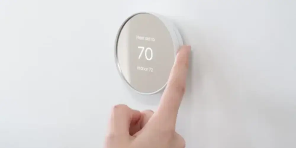 Google Nest Thermostat with a modern design and digital temperature display